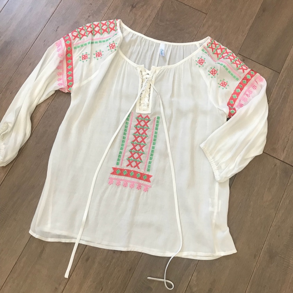 White, pink, and green embroidery top